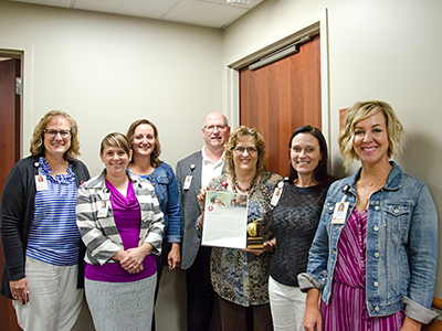 Image of Susan Matthiesen, audiologist, receiving the Legend Award for the second quarter of 2018 because of her everyday philanthropy.