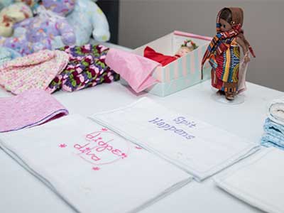 The JRMC Auxiliary is selling items like these burb cloths to support the 235 babies born at the Family BirthPlace each year.