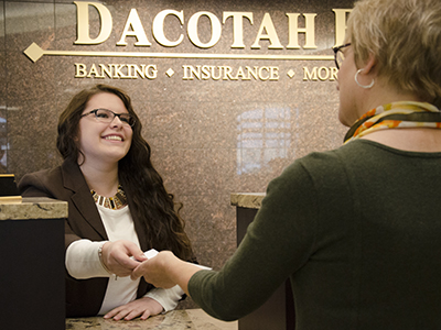 Image of Dacotah Bank employee after they donated $25,000 to the JRMC Cancer Center.