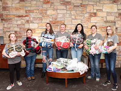 Higher Power Youth League students from the Gackle Emanuel Lutheran Church donated tie blankets and a $250 gift card to the Kala's Korner program at JRMC.