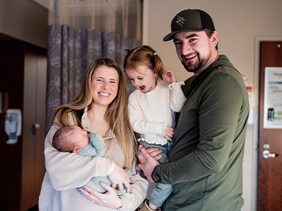 Image of family with newborn baby.