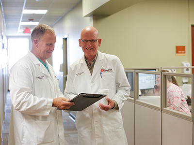 JRMC Urologist, Dr. Robert J. Bates chose fellow coworker and Orthopedic Surgeon, Dr. Michael T. Dean, to perform his second knee surgery.
