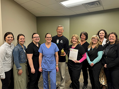 image of nurses honoring May 2024 Legend Award winner Pat Walter