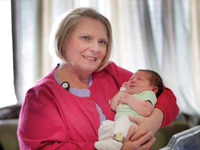 Image of Marla Wegner holding a newborn baby born at JRMC.